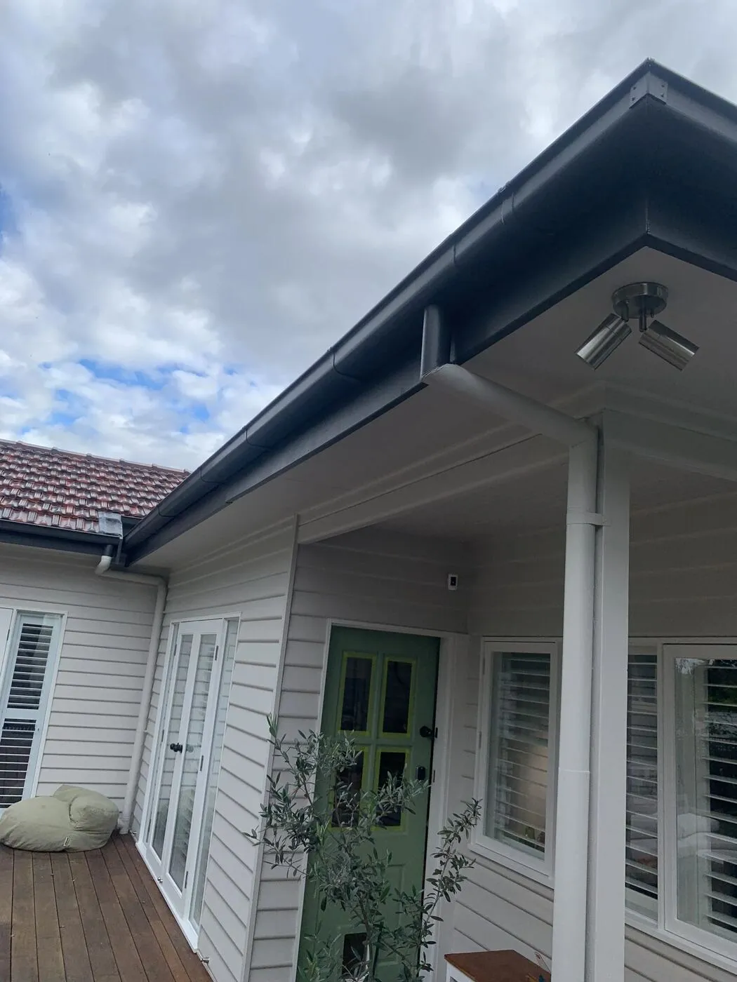 New Colorbond gutter installation and downpipe replacement on a weatherboard Melbourne home